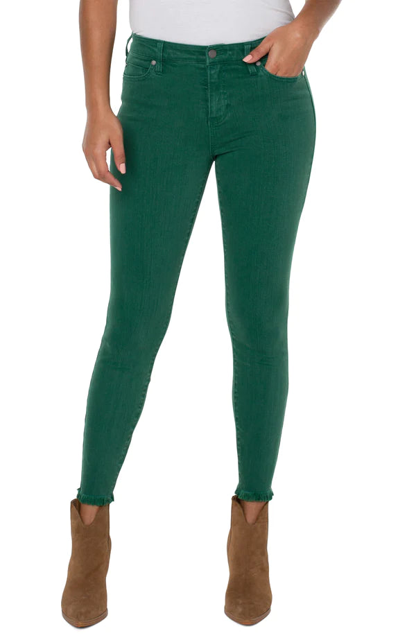 Woman wearing green skinny jeans 