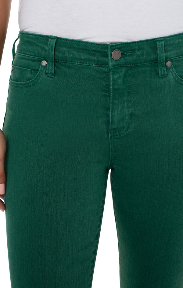 Woman wearing green skinny jeans