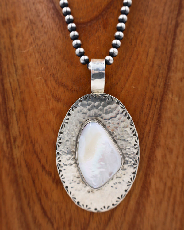 RICHARD SCHMIDT OVAL MOTHER OF PEARL WITH STAMPING PENDANT